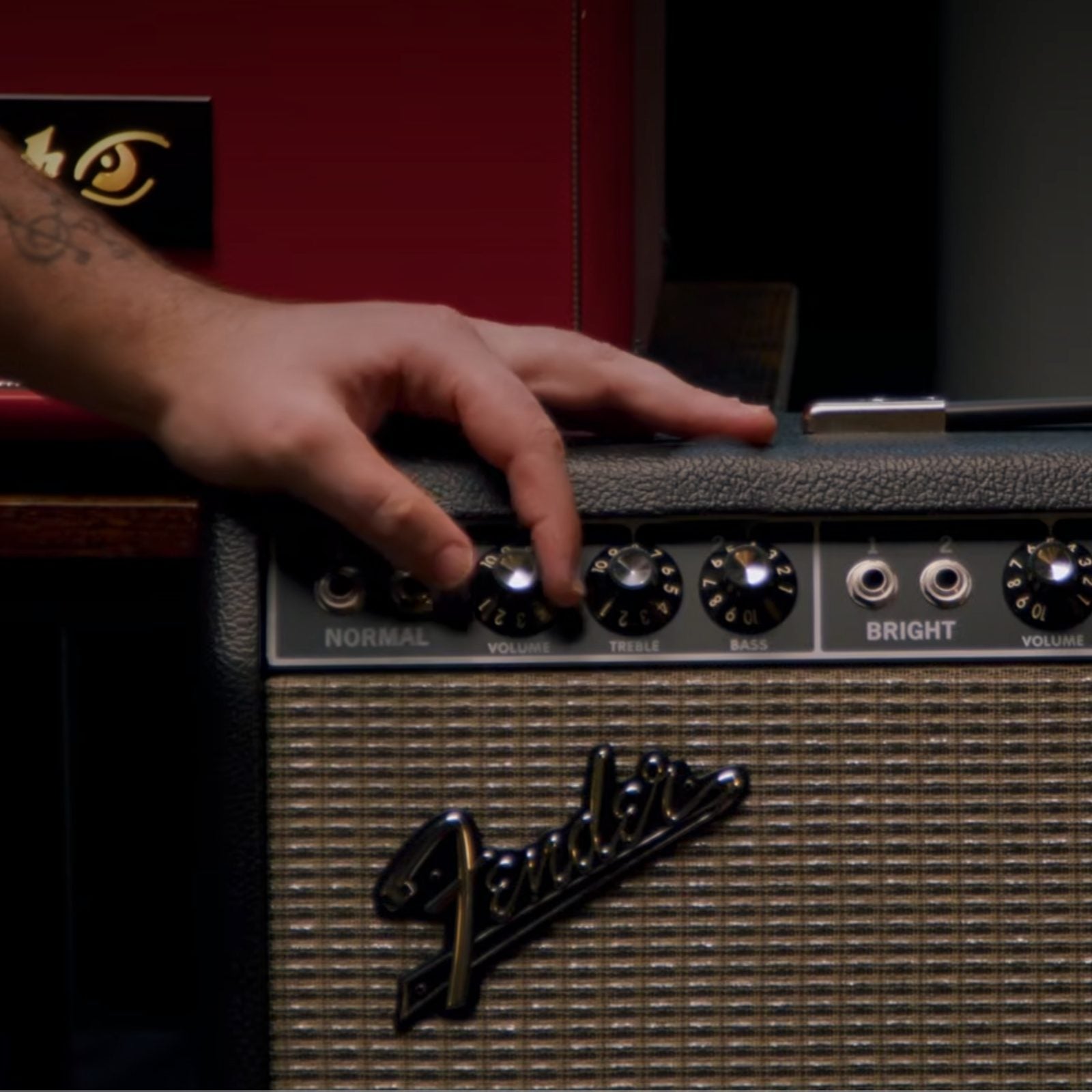 Hand dialing in the normal-channel volume on a Fender Deluxe Reverb